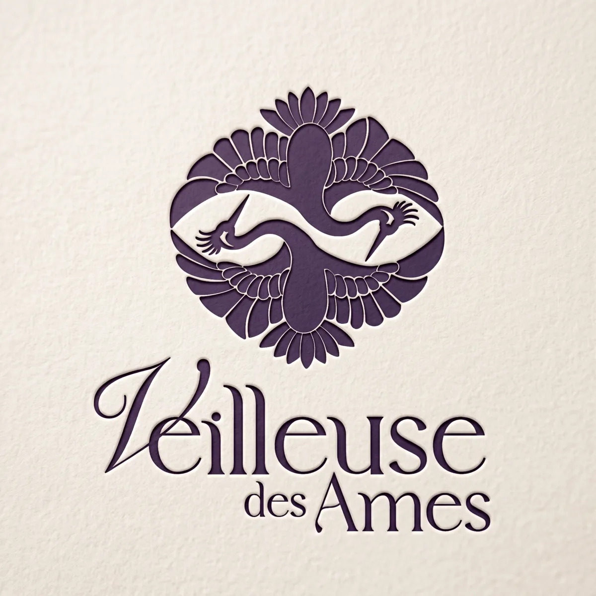 Logo Veilleuse des Âmes gravé sur papier crème